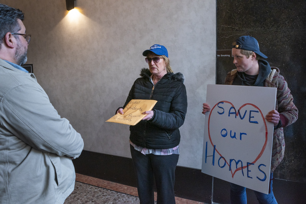 Park Residence Heather Malone alongside Gillian Pater-Lee from NEOCH present a representative from WRLC with signed petitions from United Residents of Euclid Bea